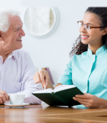 Caregiver keeping senior man company